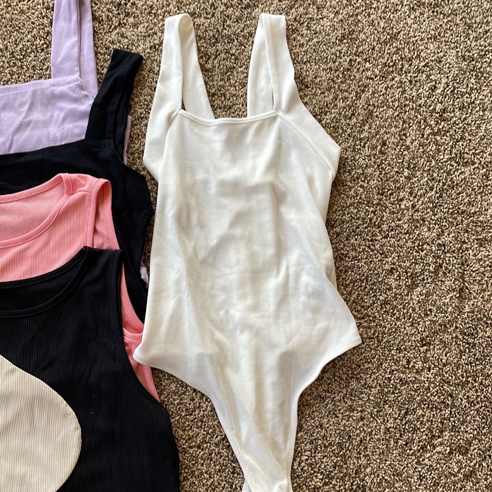 NEW size large but runs more like medium, and a body suit size small. Lot of 4 - Picture 2 of 9